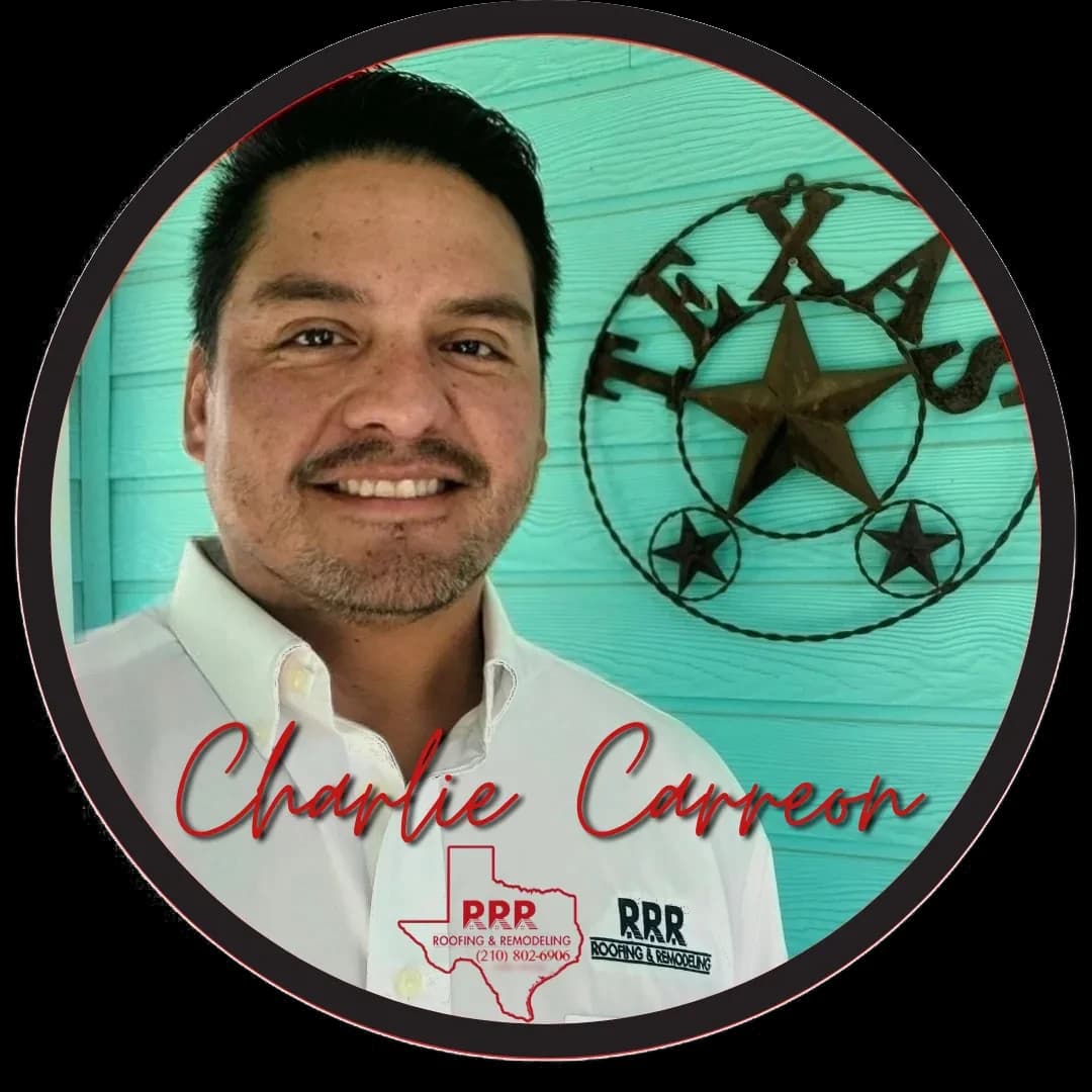 Charlie Carreon, owner of Texas-RRR, in a white shirt in front of a teal wall with a Texas star sign.